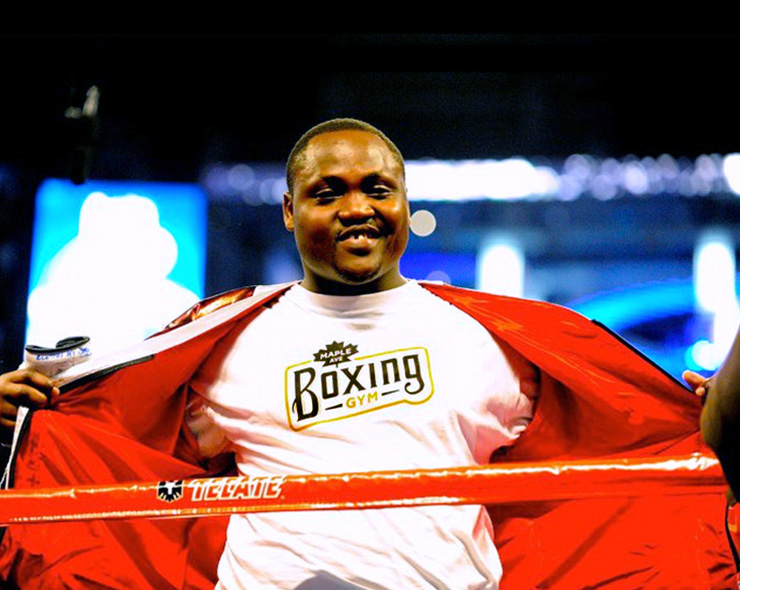 <h4>Promotional items got a lot of mileage thanks to the owner's professional boxing connections. Here a member of Joshua Clottey's entourage models a MABG t-shirt.</h4>